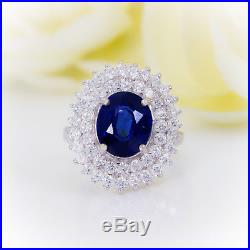 7.20 CTW Blue Sapphire with Diamond Halo set in Pure White Gold