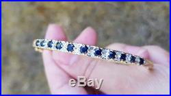 9ct yellow gold bangle set with diamonds 0.22ct and sapphires. Perfect gift