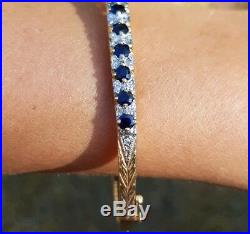 9ct yellow gold bangle set with diamonds 0.22ct and sapphires. Perfect gift