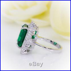 Cushion Cut Emerald with Diamond Halo set in Pure White Gold